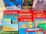 several books are stacked on top of each other on a table