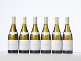 four bottles of white wine lined up in a row