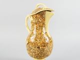 yellow and white pitcher with gold decoration on top