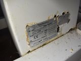 a dirty toilet that has a label on it