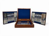 an image of a set of silverware in a wooden case