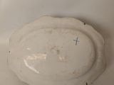 a white plate with a blue cross on it