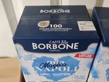 two boxes of coffee are stacked on top of each other