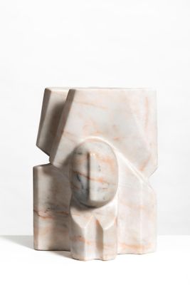 marble sculpture of a cube with a sphere in the center on a white surface