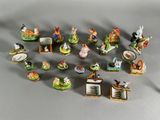 a lot of small figurines that are sitting on a table