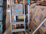 a ladder that is next to a pile of boxes