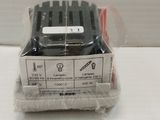 a package of black and white batteries on a white surface