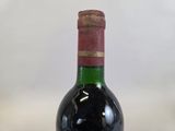 a bottle of wine that is sitting on a table