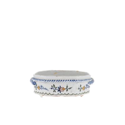 a white bowl with blue and yellow designs on it