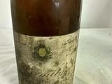 a bottle of wine that is sitting on a table