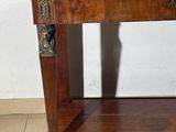 a wooden table with a marble top on it