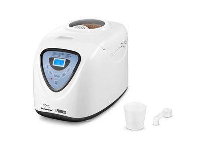 a close up of a toaster with a cup next to it