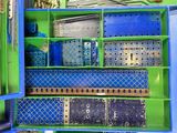 a blue and green box filled with assorted items