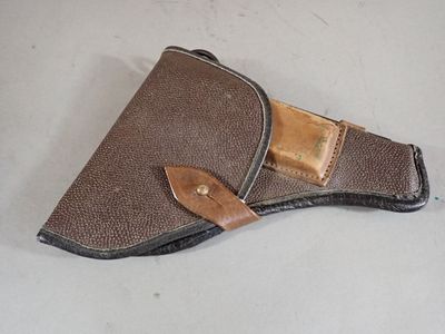 a brown leather holster with a brown leather belt