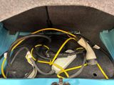 a car trunk with a bunch of wires and wires in it