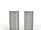 pair of silver glass vases on white surface with white background