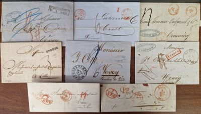 many old envelopes with stamps on them sitting on a table