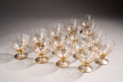 a lot of glasses that are sitting on a table