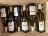 six bottles of wine in a box with labels on them