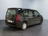 the black van is parked in the empty room of the building