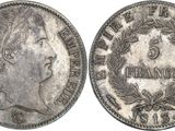 a silver coin with an image of a woman on it