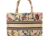 an image of a handbag with a floral design on it