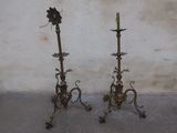 pair of antique brass candlesticks with flowers on each of them