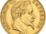 a close up of a gold coin with a man ' s face on it
