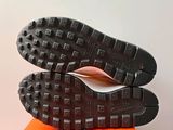 a pair of shoes that are on top of a box