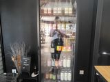 a refrigerator that has a lot of bottles in it