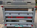 a close up of a trailer parked on the side of a road