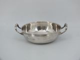 a silver plate with handles and handles on a white background