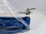 a picture of a plastic bag with a blue handle on it