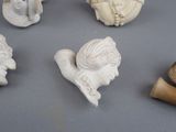 a lot of small statues that are on a table