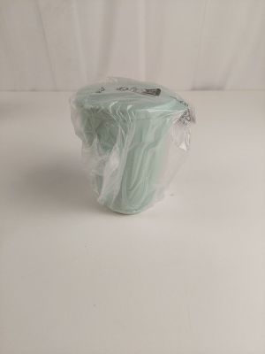 a plastic bag with a piece of cloth in it on a white surface