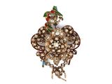 an image of a close up of a brooch with a bird on it