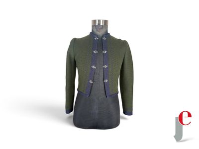 an image of a mannequin wearing a green coat