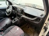 a dirty dashboard of a small car with a steering wheel