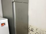 an image of a kitchen with moldy walls and a refrigerator