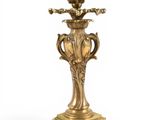 a gold candle holder on a white background with a white background