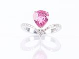 a pink tourmaline and diamond ring on a white background