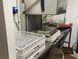 a kitchen with a sink and a dishwasher in it