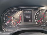 a close up of a car dashboard with various gauges