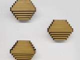 three pieces of wood are arranged on top of each other