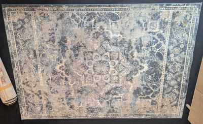 an image of a picture of a rug on display in a room
