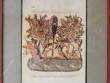 framed picture of a painting of a bird and a deer in a garden