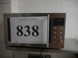 a microwave that has a sign on it that says 388