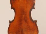 an old violin with the back of the neck missing