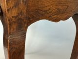 a close up of a wooden table with a drawer on it