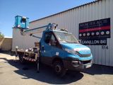 a blue truck that is parked in front of a building